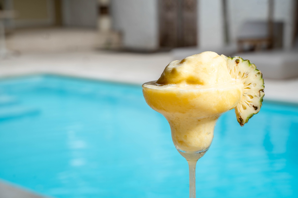 Frozen pineapple daiquiri by the pool